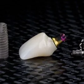 Two different dentals implant and crown of ceramics on black textured background